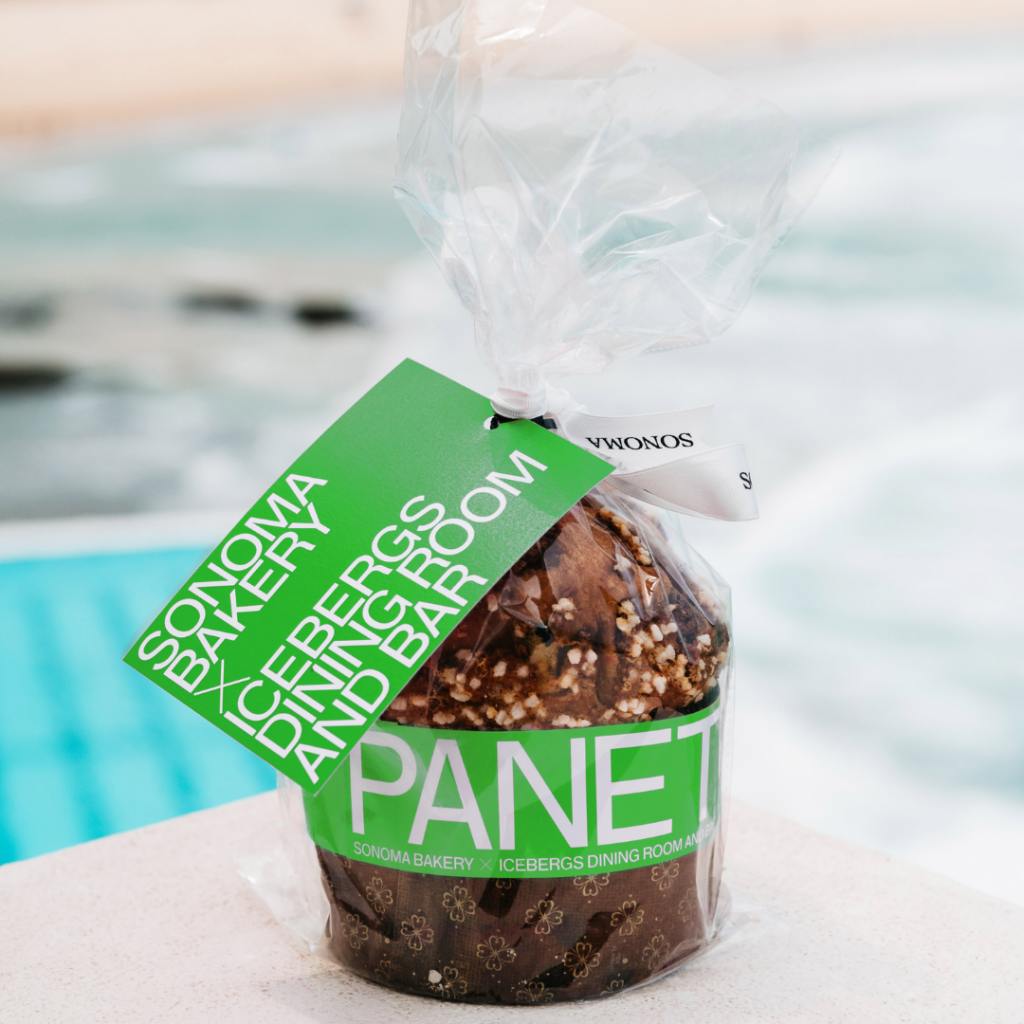 Icebergs panettone wrapped with a green tag beside the pool