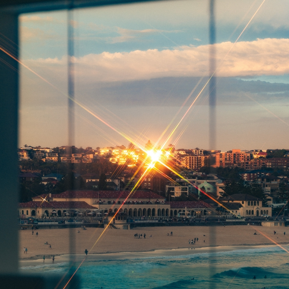 Low sun over Bondi Beach through the Pacific Dining Room windows